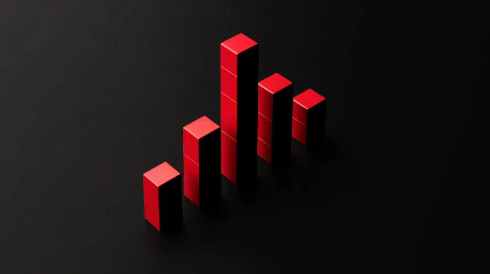 Grafic roșu de creștere pe fundal negru, reprezentând progresul campaniilor de marketing.